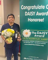 Jasper Anggo receiving his DAISY Award