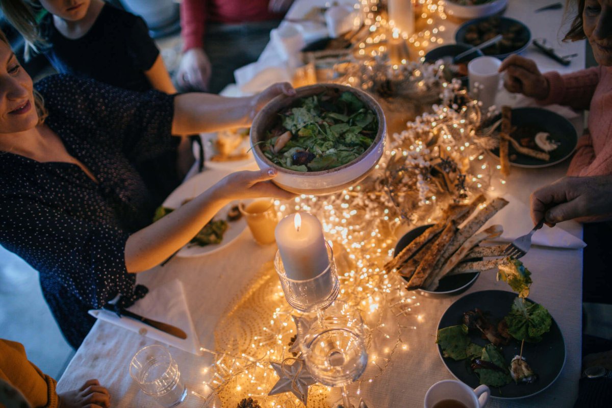 Healthy side dish being passed around holiday table.