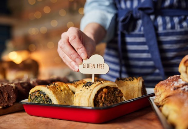 A tray of food with a gluten free sign