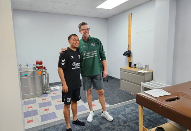 SWH Palmdale doctor and AV ALTA FC Player smiling for the camera in the Palmdale Rehabilitation Institute