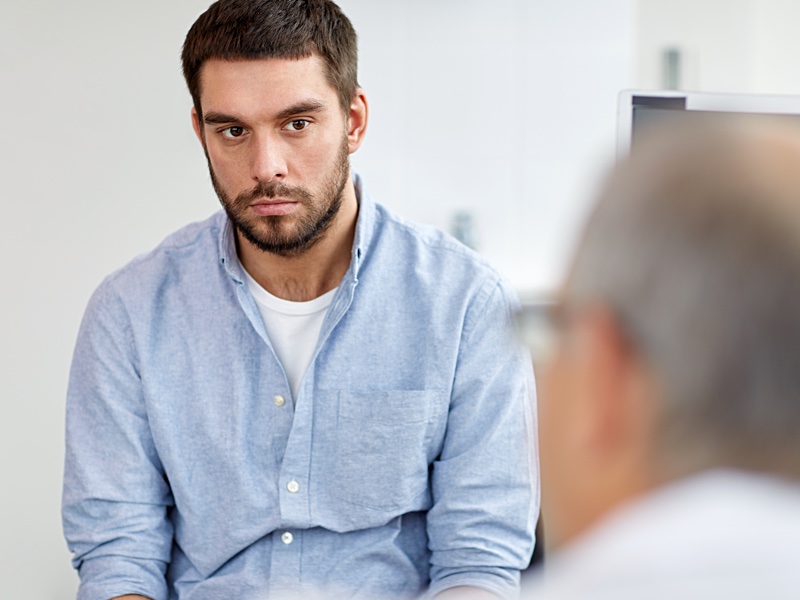 man at doctor visit